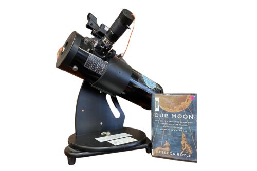 Telescope with a book call Our Moon