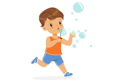 Little boy blowing bubbles with wand